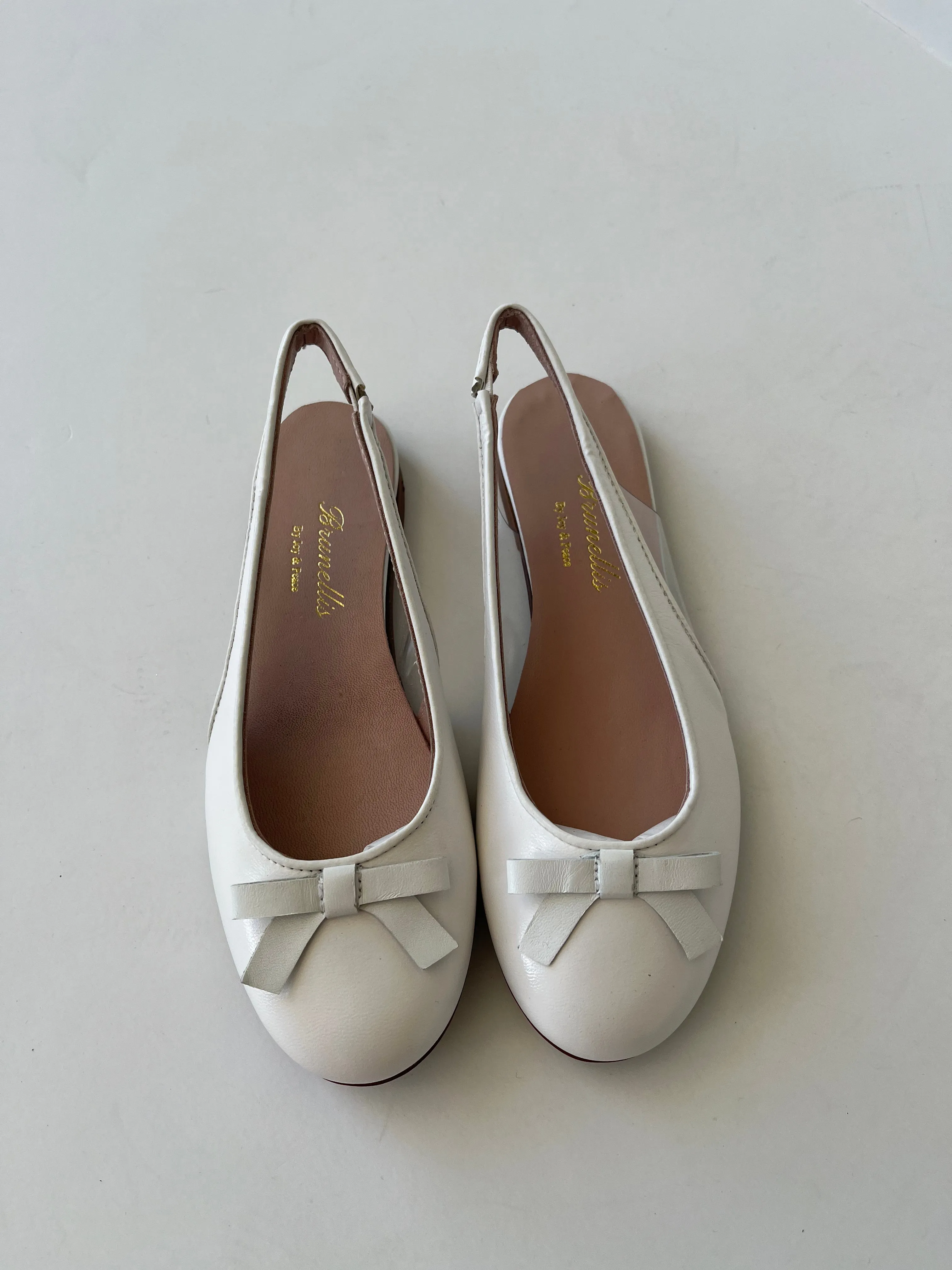 White leather sling back with front bow